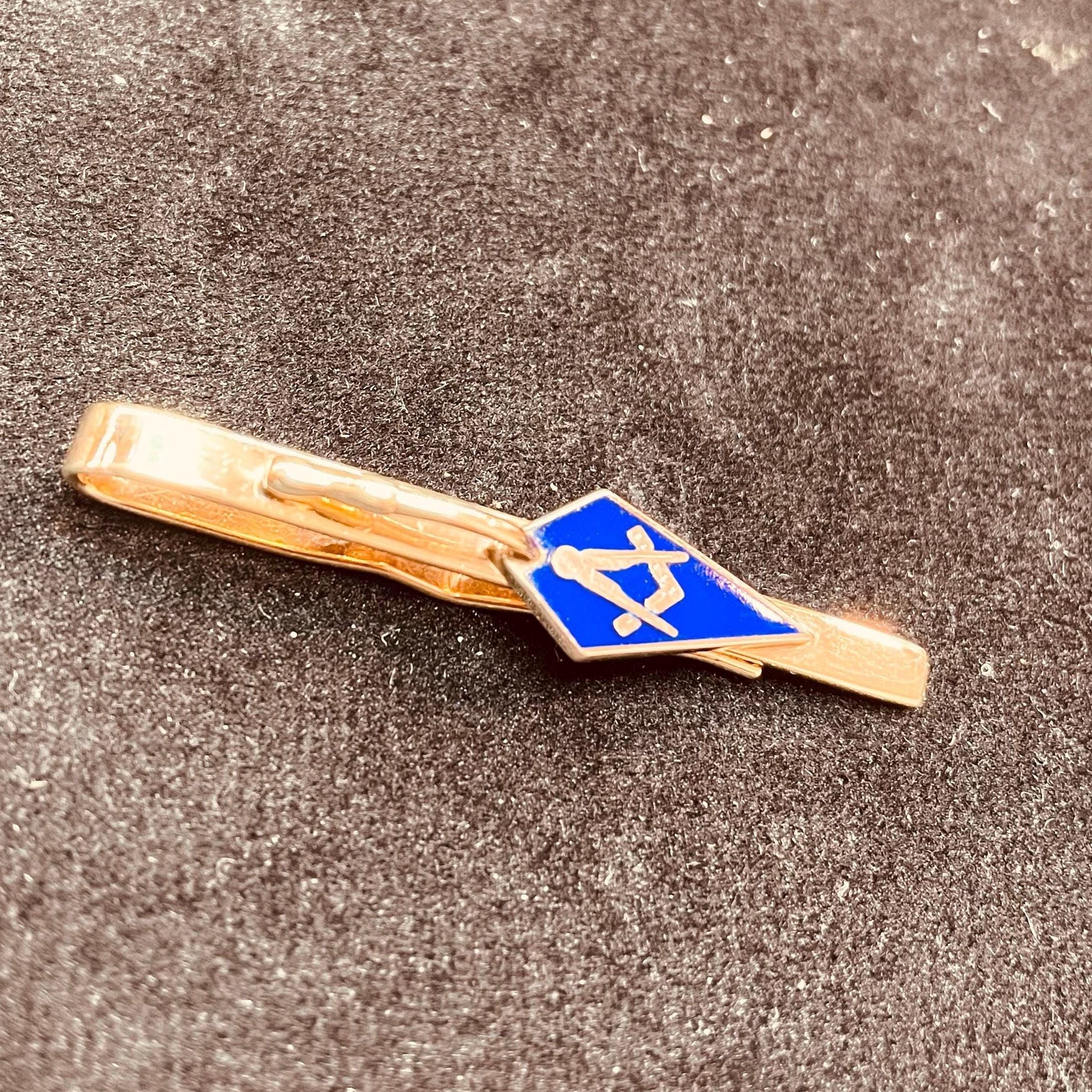 Masonic tie slide. square and compass. blue enamel. masons trowel